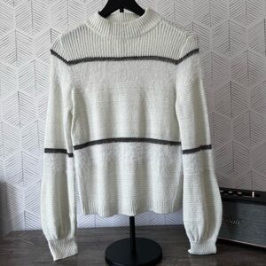 Jennifer Lopez White and Gray Turtleneck Sweater